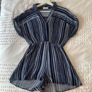 cinched at the waist and has buttons.